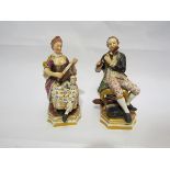 Two 19th Century Derby figures, one playing a lute with a dog on her lap, the other playing a flute,