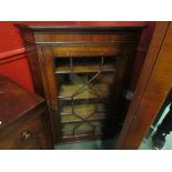 A George III North Country oak astragal glazed single door wall hanging corner cabinet with