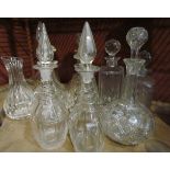 A collection of decanters including Edinburgh crystal and a carafe