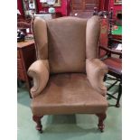 A 19th Century walnut wing back fireside armchair the scroll arms over pad foot cabriole legs and