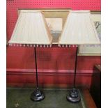 A pair of slender table lamps with silk beaded shades,