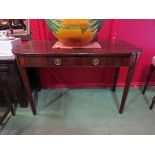 A George III mahogany D-shaped top table the single frieze drawer over square tapering legs,