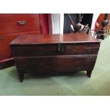 An 18th Century oak six plank coffer of small proportions with chipped carved decoration,