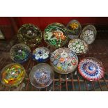 A collection of glass paperweights to include millefiori,