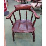 A 19th Century elm broad arm captains armchair