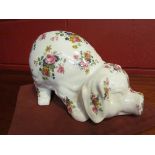 A pig figure decorated with flowers