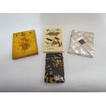 A Japanese shibayama card case depicting flowers and a bird on one side and a bird,