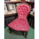 A balloon-back chair with acanthus leaf carving, button upholstered backrest,