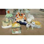 A collection of Victorian and later china figurines to include Branksome cat and ball, sheep,