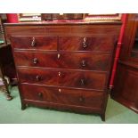 Circa 1820 an inlaid flame mahogany canted corner chest of two short over three graduating long