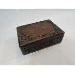 A carved Eastern hardwood box containing playing cards,