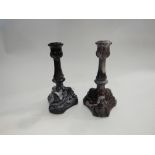A pair of Victorian Davidson purple and white slag glass candlesticks