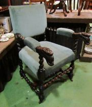 A 19th Century Jacobean style oak armchair with spiral twist and carved decoration on ceramic