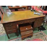 Circa 1910 an oak twin pedestal desk of seven drawers with brass swan neck handles the tooled