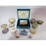 A collection of modern enamel pill boxes to include Halcyon Days examples