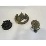 Two lion mask door knockers and another as a horses head and horseshoe (3)