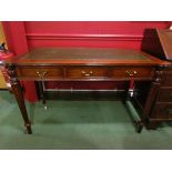 In the manner of "Arthur Brett of Norwich" a George III style mahogany writing desk the gilt tooled