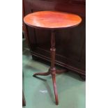 A 19th Century mahogany wine table the circular top on turned column and tripod base,