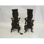 A pair of Oriental bronzed metal vases of tree form,