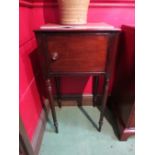 A George II flame mahogany pot cupboard the single door over fine tapering turned legs.