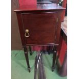 A 19th Century mahogany pot cupboard the single door over turned and tapering legs,