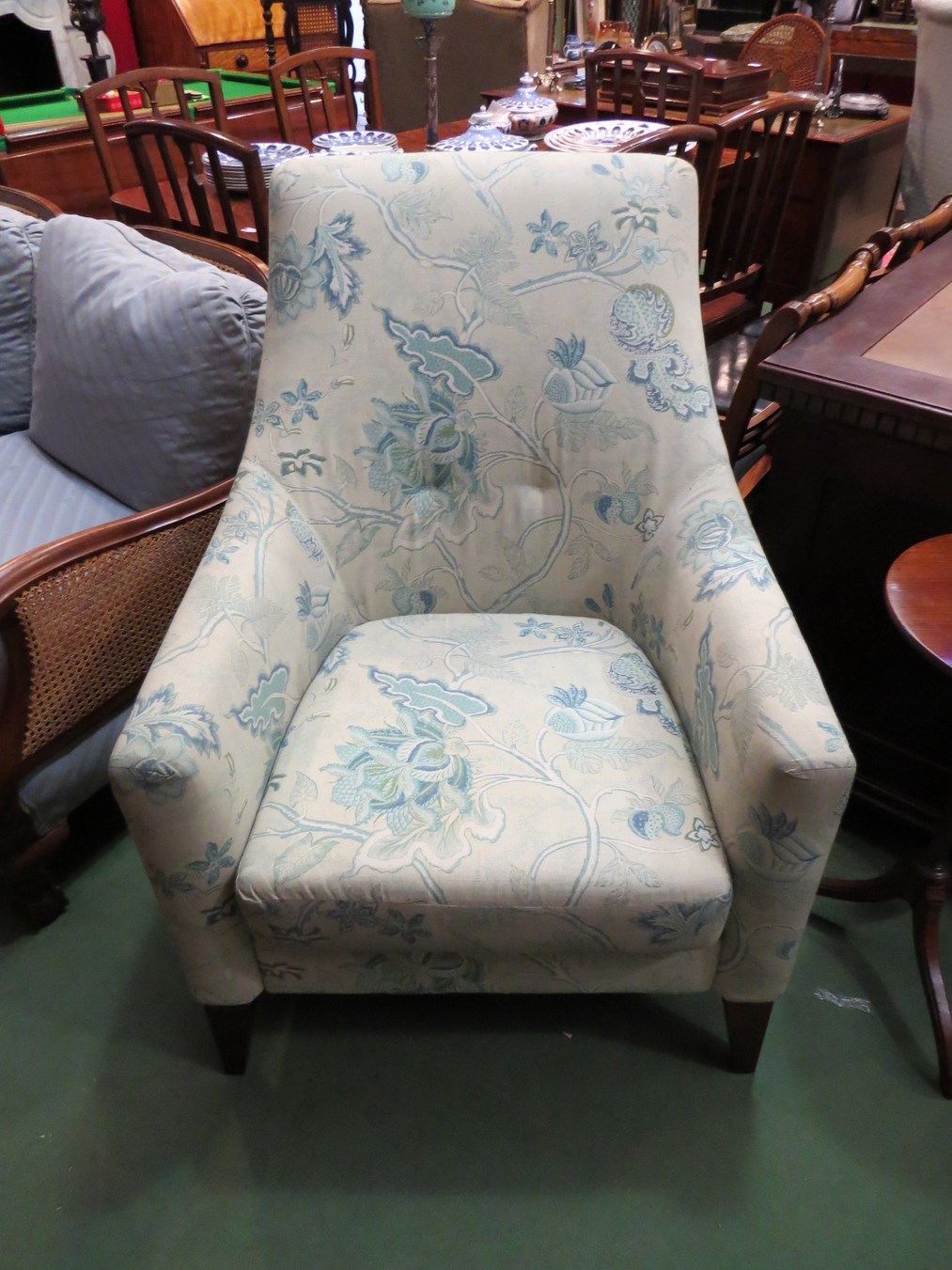 A 'Wesley Barrell' armchair on square tapering legs,