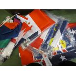 A quantity of flags including multicoloured bunting