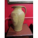 A large studio pottery stoneware jug with potter's cipher "EH",