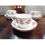 A quantity of 19th Century cups & saucers with floral decoration