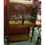 A George III mahogany reeded edge bookcase/cabinet the two astragal glazed doors over two drwers