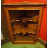 A George II style burr walnut corner shelf,