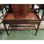A George III style mahogany butlers tray on stand with fret handles and shaped raised gallery on