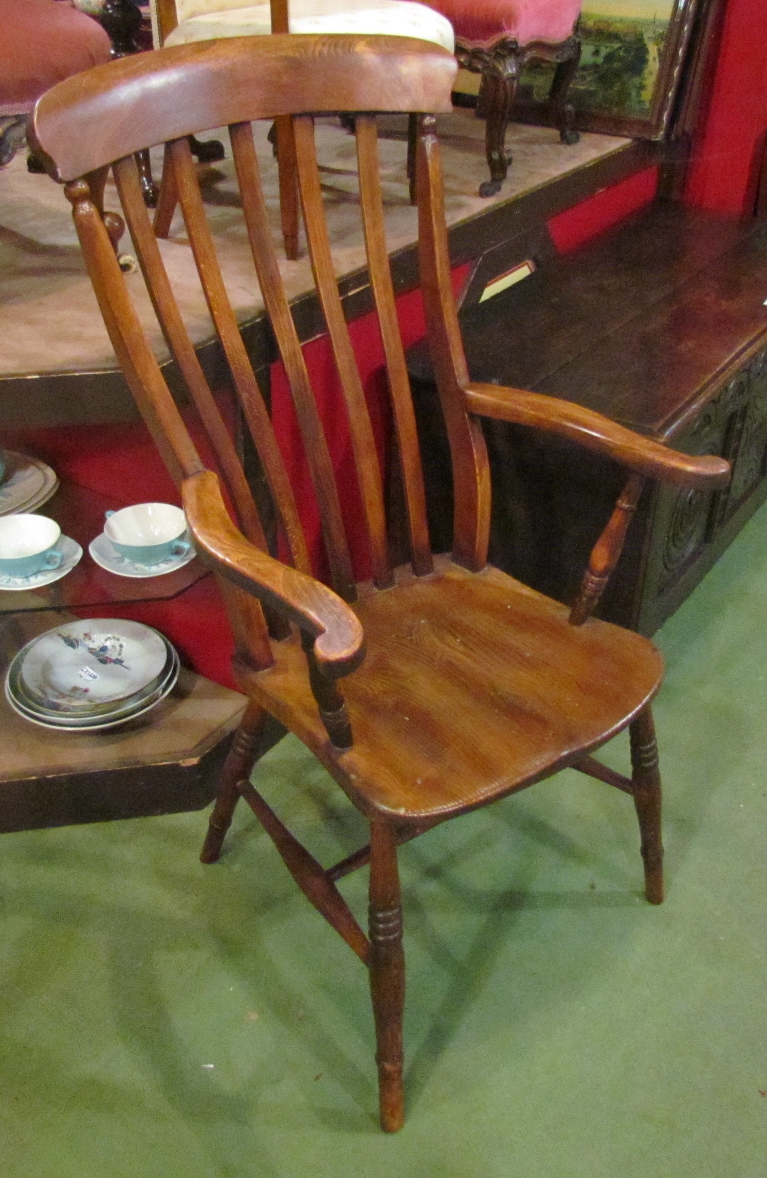 A Victorian elm seated slat back grandfather chair