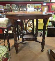 A hexagonal late Victorian occasional table with spindle turned legs, 'X' stretcher with pierced,