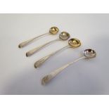 A pair of silver gilt Georgian salt spoons (London, 1816, WS) and two other condiment spoons,