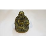 A brass laughing Buddha,