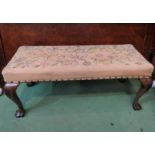 A 19th Century walnut end of bed/duet stool the needlepoint upholstered seat on shell carved