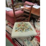 A pair of Chippendale design mahogany ladder back chairs with needlepoint seats having English oak