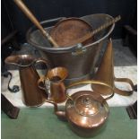 A selection of assorted copper wares including coal helmet, kettle, jugs etc.