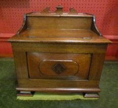 An Arts & Crafts walnut table top vanity cabinet with rising lids & internal mirror.