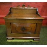 An Arts & Crafts walnut table top vanity cabinet with rising lids & internal mirror.