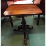 A Victorian walnut round cornered top wine table on a turned & carved tripod base with scroll feet,