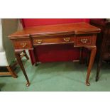 A 19th Century crossbanded inlaid walnut break front games table stamped 'Maple & Co.