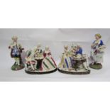 A pair of figures and two figural groups "taking tea" and card game (4)