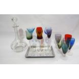 A set of six coloured glasses on tray,