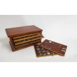 A coin cabinet of ten trays,