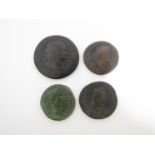 Four Roman bronze coins including Sestertius of Titus (79-81AD) two dupondis of Domitian (81-96AD)