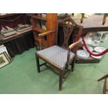 A George III elm Chippendale design elbow chair