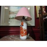 A 20th Century Japanese white ceramic table lamp base with Geisha girl design in orange clothing,