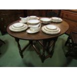 An 18th Century oak gate leg oval top table the rising leaves over a single cutlery drawer on